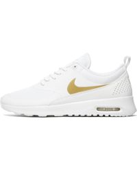 nike thea white and gold