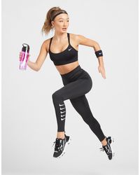 nike running swoosh repeat tights