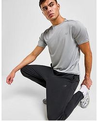 New Balance - Pantaloni Sportivi Essential Woven - Lyst