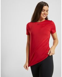 pantalones nike dorados