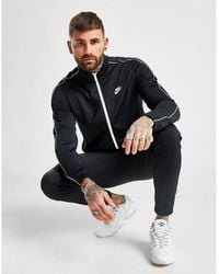 blue nike poly tracksuit