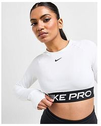 Nike - Top Crop a Maniche Lunghe Training Pro - Lyst