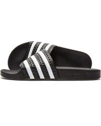 Adilette Lyst Adidas ultra Explorer diapositivas en negro para hombres Adilette Lyst Adidas ultra Explorer diapositivas en negro para hombres