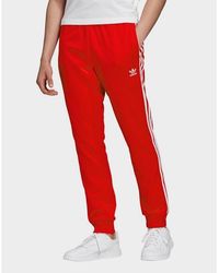 adidas sst tracksuit red