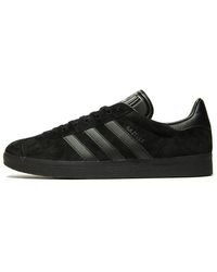 mens all black gazelles