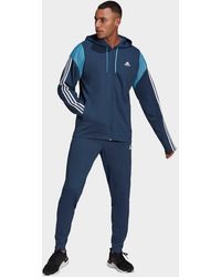 blue adidas tracksuit men