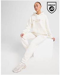 New Balance - Pantaloni della Tuta Tones Logo - Lyst
