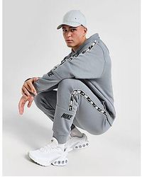 Nike Repeat Pack Taping Cuffed joggers in Grey for Men Lyst UK