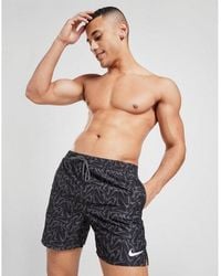 nike swimming 5inch volley shorts with all over swoosh print in black
