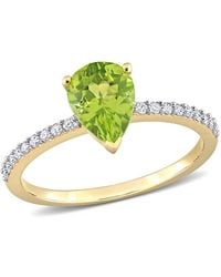 Amour - 1 1/7 Ct Tgw Pear Shape Peridot And 1/7 Ct Tdw Diamond Ring - Lyst