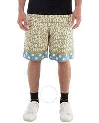Versace - All-Over Logo Print Shorts - Lyst