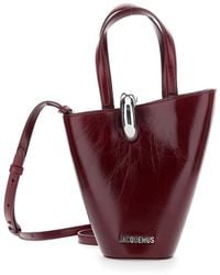 Jacquemus - Le Petit Bambola Bordeaux Handbag With Ring Hardware Detail And Logo Lettering - Lyst