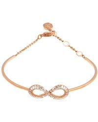 Swarovski - Ladies Rose-Tone Hyperbola Bangle, Size Medium - Lyst