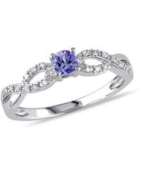 Amour - 1/10 Ct Tw Diamond And Tanzanite Infinity Ring - Lyst