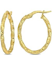 Amour - 24Mm Oval Twisted And Textured Hoop Earrings - Lyst
