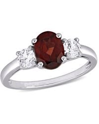 Amour - Oval Cut Garnet And Created Sapphire 3-Stone Ring - Lyst