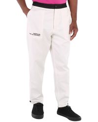 Moncler - Logo Embroidered Cotton Tapered Trousers - Lyst