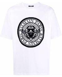Balmain - Flock Logo Embossed Cotton T Shirt - Lyst