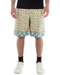 Versace - All-Over Logo Print Shorts - Lyst