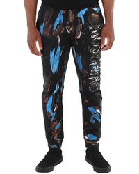 Moschino - Painted Logo Cotton-Jersey Trousers, Brand Size 46 (Waist - Lyst