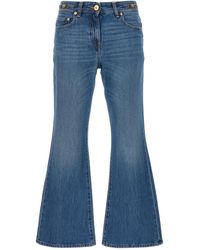 Versace - Flared Denim Jeans With Metallic Jellyfish Detail - Lyst