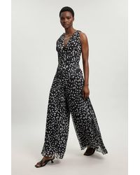 Karen Millen - Petite Polka Dot Crinkle Cross Back Georgette Woven Jumpsuit - Lyst