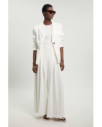 Karen Millen - Petite Tailored Structured Crepe Pleated Wide Leg Trousers - Lyst