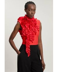 Karen Millen - Figure Form Bandage Knit Woven Rosette Detail Top - Lyst