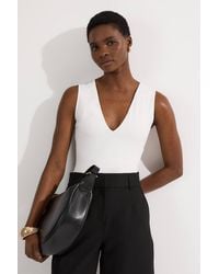 Karen Millen - Stretch Cotton Plunge Neck Jersey Bodysuit - Lyst