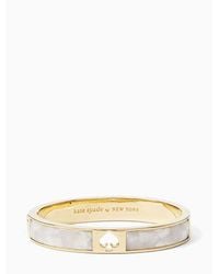 Kate Spade - Hole Punch Spade Hinge Bangle, Cream - Lyst