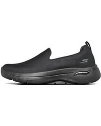 Skechers - (Wmns) Go Walk Arch Fit Slip On 'Triple' - Lyst