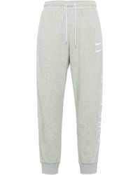 Nike - Sportswear Swoosh Logo Slim Fit Bundle Feet Sports Long Pants - Lyst