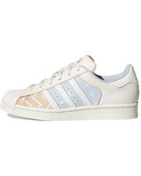 adidas - (Wmns) Originals Superstar Comfortable Wear-Resistant Sneakers Creamy 'Cream Light Bluegray' - Lyst