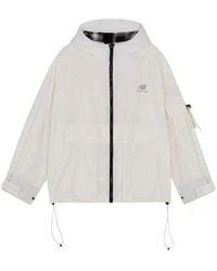 New Balance - (Wmns) Logo Printing Woven Sports Hooded Jacket Milky - Lyst