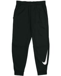 Nike - Therma Tapered Swoosh Fleece Lined Sports Training Long Pants - Lyst
