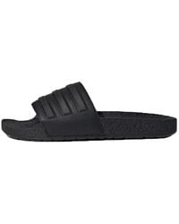 adidas - Adilette Boost Slides 'Triple' - Lyst
