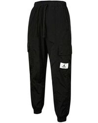 Nike - Essentials Pocket Woven Label Logo Drawstring Bundle Feet Sports Pants - Lyst