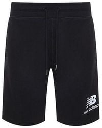 New Balance - Essentials Stacked Logo Shorts - Lyst