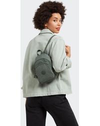 Kipling - Backpack New Delia Compact Sign Emb Small - Lyst