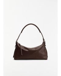 Lemaire - Belted Leather Baguette Bag - Lyst