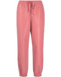Stella McCartney - Faux-leather Tapered Trousers - Lyst