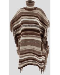 - Save 9% Womens Clothing Jumpers and knitwear Ponchos and poncho dresses Chloé Synthetic Quilted Funnel Neck Fringed Poncho in Beige Natural 