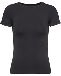 Skims Tan Soft Smoothing T-shirt in Black | Lyst