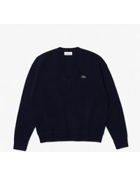 Lacoste - Jersey liso de lana con cuello en V - Lyst