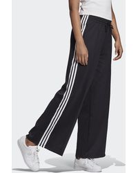 Pantalon ancho de Pantalones para Mujer de adidas | FASHIOLA.es