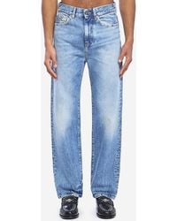 Versace - Stonewash Jeans With Studs - Lyst