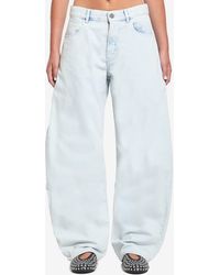 Alaïa - Rounded Denim Jeans - Lyst