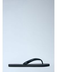 Prada - Logo-Embossed Leather Flip-Flop Sandals - Lyst