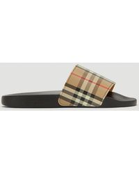 nike slippers with gold check