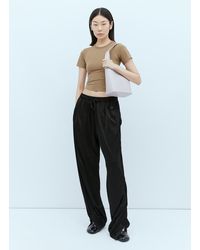 Aesther Ekme Demi Lune Assymetrical Brick Bucket Bag on model  02PF19DLL02127 - i-D Concept Stores